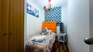 Postel nebo postele na pokoji v ubytování Santiago Centro 2 dormitorios check in tardío