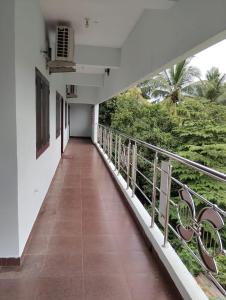 a corridor of a building with a balcony at Aruna homes -Lakshana- Thanjavur in Thanjāvūr