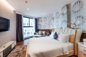 Μια τηλεόραση ή/και κέντρο ψυχαγωγίας στο Apec Mandala Apartment Sunrise & Sea View