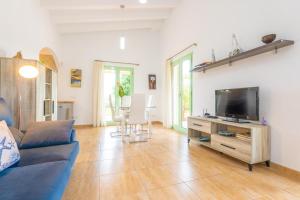 TV a/nebo společenská místnost v ubytování Sa Plana de Baix