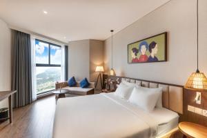 Ένα ή περισσότερα κρεβάτια σε δωμάτιο στο Apec Mandala Apartment Sunrise & Sea View +99 φωτογραφίες