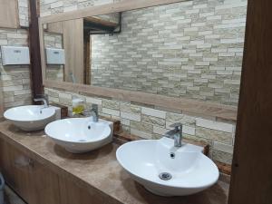 a bathroom with two sinks and a mirror at Tehran mets armenia in Yerevan +14 photos