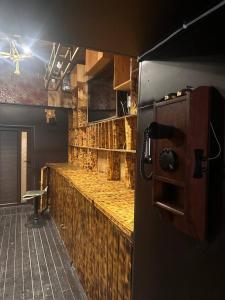 a kitchen with a bar with a wooden counter top at Tehran mets armenia in Yerevan