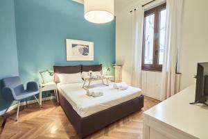 Ένα ή περισσότερα κρεβάτια σε δωμάτιο στο Easylife - Milano - Battisti 13 - Duomo