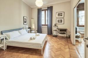 Ένα ή περισσότερα κρεβάτια σε δωμάτιο στο Easylife - Milano - Battisti 13 - Duomo