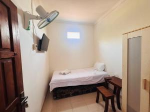 En eller flere senge i et værelse på CQA Living TANA 1 By ARBA