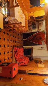a room with a bunk bed and a couch in it at Villa Anna Palumbo Sila in Torre Caprara