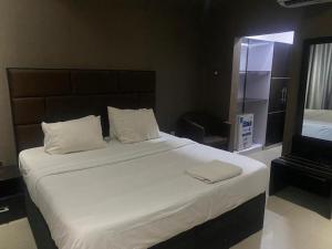 Ένα ή περισσότερα κρεβάτια σε δωμάτιο στο Modex Hotel