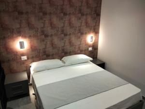 Giường trong phòng chung tại HB Appartamenti Suite