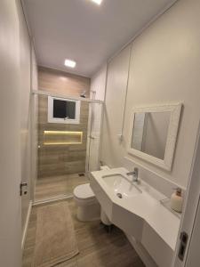 Et badeværelse på Casa de temporada Capão da Canoa