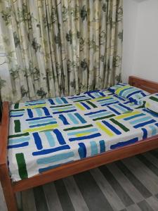 Postel nebo postele na pokoji v ubytování Triveni Home