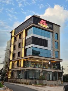 ein Gebäude mit einem Schild darauf in der Unterkunft DVR GRAND-AC Rooms in Visakhapatnam