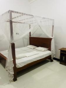 Ένα ή περισσότερα κρεβάτια σε δωμάτιο στο Agapeh Cottage