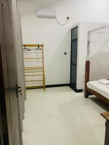 Ένα ή περισσότερα κρεβάτια σε δωμάτιο στο Agapeh Cottage