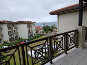 a balcony with a view of a parking lot at 54 Topanga Holiday Accommodation in Margate