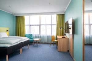Ένα ή περισσότερα κρεβάτια σε δωμάτιο στο Thon Hotel Verdal +10 φωτογραφίες