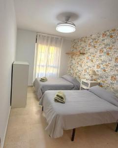 Postel nebo postele na pokoji v ubytování Beatiful and full-equipped flat in the city center