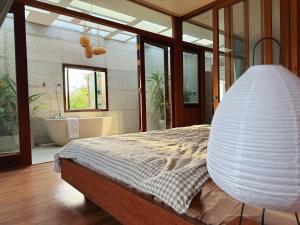 Ένα ή περισσότερα κρεβάτια σε δωμάτιο στο Le Home Phan Rang