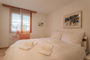 Ένα ή περισσότερα κρεβάτια σε δωμάτιο στο LAAX Homes Val Mulin 91B