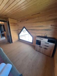 a room with a sink and a window in a cabin at Wooden villas in Chrysoupolis