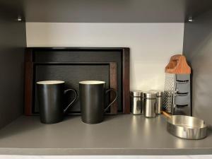 Příslušenství pro přípravu čaje a kávy v ubytování Toon 33 + 5 fotografií