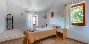 Postel nebo postele na pokoji v ubytování Ćunski