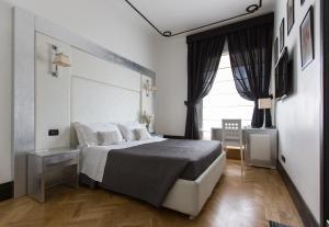 Postel nebo postele na pokoji v ubytování Residenza Scipioni Luxury B&B