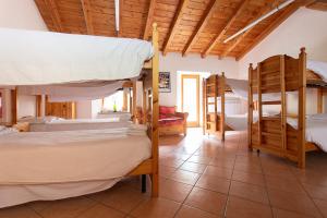 Ένα ή περισσότερα κρεβάτια σε δωμάτιο στο Le Quartier