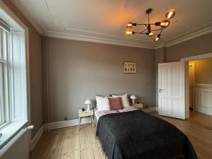 En eller flere senge i et værelse på Charming Luxury Flat Nørrebro I Super Rare Find