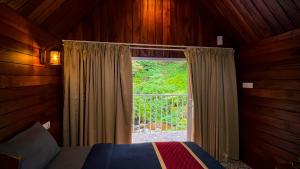 Ένα ή περισσότερα κρεβάτια σε δωμάτιο στο Zeno Village Resort, Near 900 Kandi Wayanad