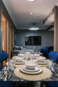 a table with plates and bowls on top of it at MELVİN HOMe in Istanbul