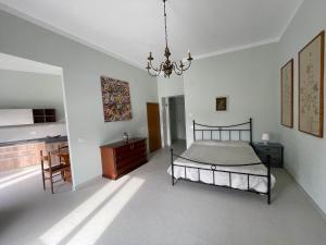 Ένα ή περισσότερα κρεβάτια σε δωμάτιο στο La Casa in Piazza