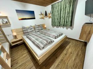 Ένα ή περισσότερα κρεβάτια σε δωμάτιο στο apart-gerlos