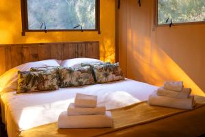 Ένα ή περισσότερα κρεβάτια σε δωμάτιο στο Fattoria delle Ripalte