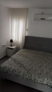 Ένα ή περισσότερα κρεβάτια σε δωμάτιο στο The Urban Suite +3 φωτογραφίες