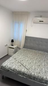 Ένα ή περισσότερα κρεβάτια σε δωμάτιο στο The Urban Suite