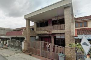 an apartment building with a balcony and a gate at PD getaway in Port Dickson