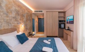 a hotel room with a bed with towels on it at Hotel Harmony-Smile in Lido di Camaiore