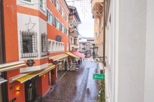 an empty street in a city with buildings at Alpine Essence - Luxury Apartment in Zell am See Center in Zell am See