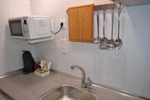 Η κουζίνα ή μικρή κουζίνα στο Minimal Apartamentos