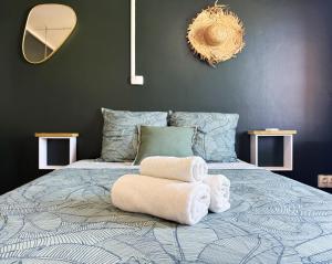 Una cama o camas en una habitación de Le Vert Sauvage - Plage et Ville - Clim