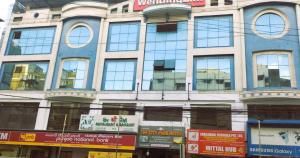 a large building with many windows on a city street at THE CITY PARK HOTEl in Hyderabad