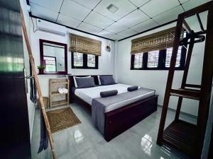 Postel nebo postele na pokoji v ubytování Jungle Serenity Villa + 28 fotografií