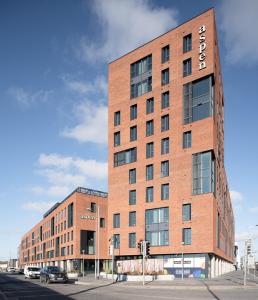 a brick building with a sign on the side of it at Aspen - Airport & City Access in Dublin