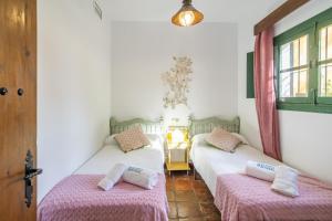 Ένα ή περισσότερα κρεβάτια σε δωμάτιο στο Cubo's Casa Rural San Cristobal Cortijo el Puntal +27 φωτογραφίες