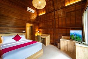 Postel nebo postele na pokoji v ubytování Klumpu Mesari Guest House + 22 fotografií