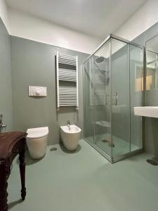 a bathroom with a shower and a toilet and a sink at Carafa di Maddaloni Residenza di Charme in Naples +55 photos