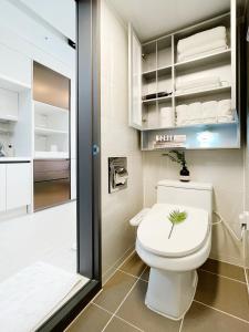 a bathroom with a toilet and a shower at 엠지스테이 서면 Mzstay Modern Hotel in Seomyeon in Busan