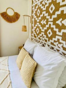 En eller flere senge i et værelse på Maison Beauséjour