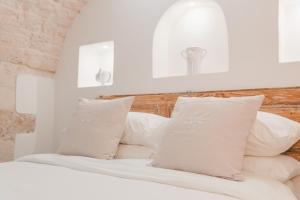 En eller flere senge i et værelse på Dimore Bianche, l'Immacolata